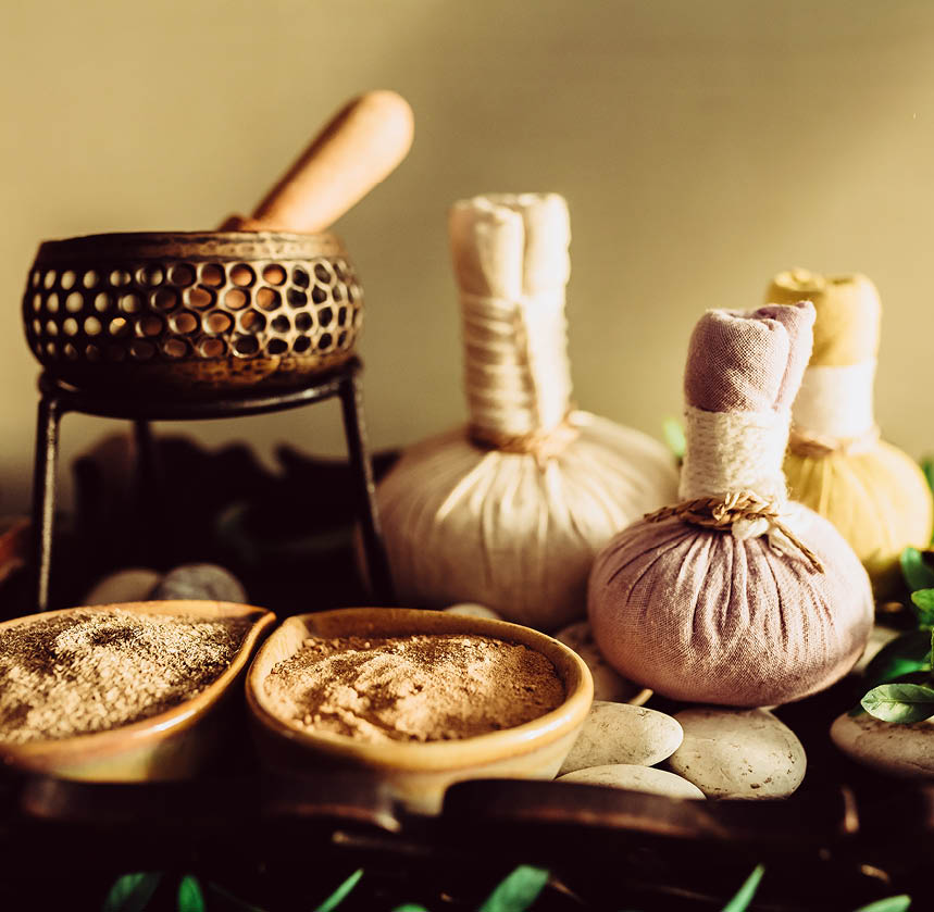 Herbs powder for traditional spa on wooden background